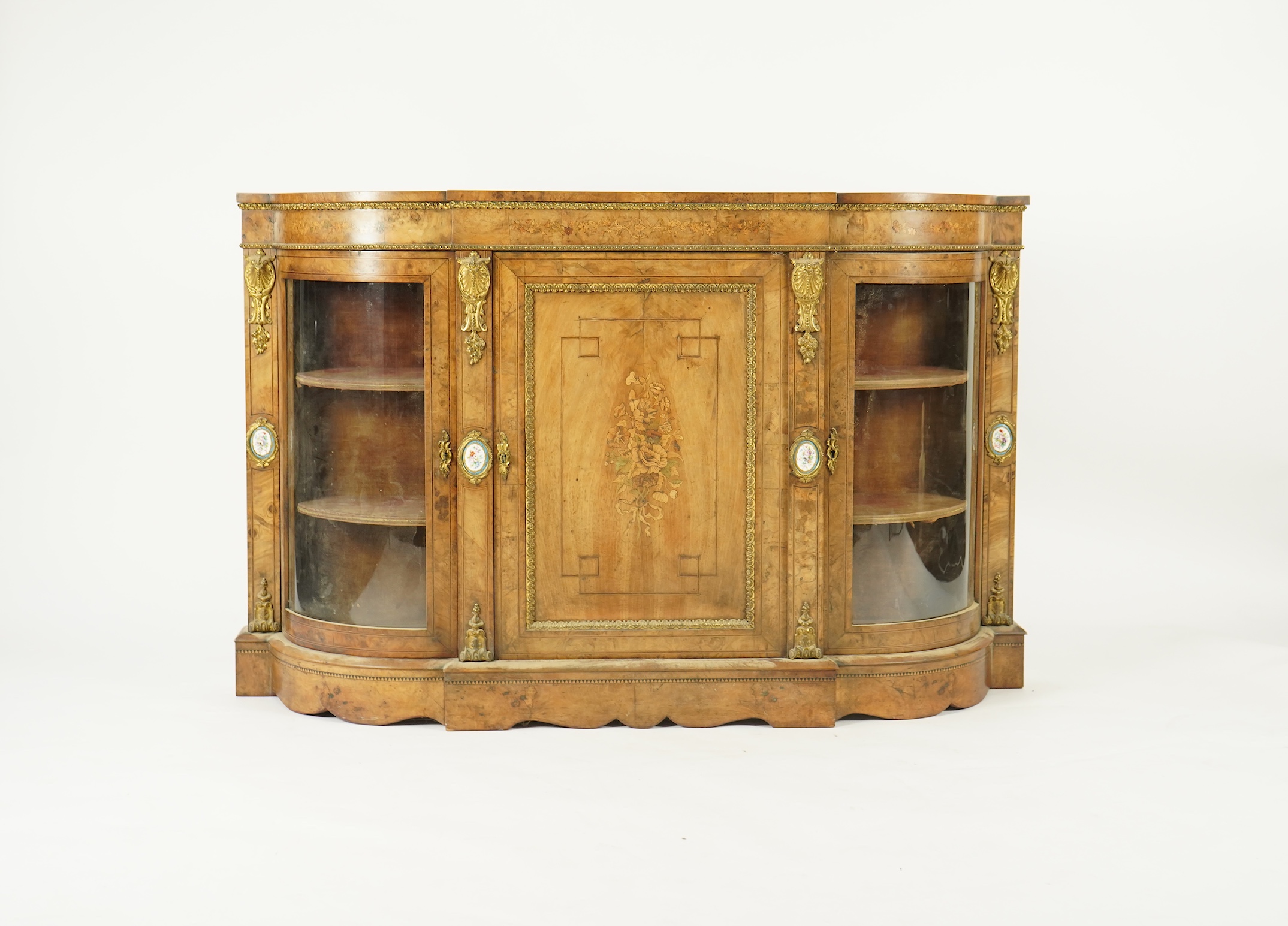 A Victorian marquetry inlaid, gilt metal mounted bowfront side cabinet